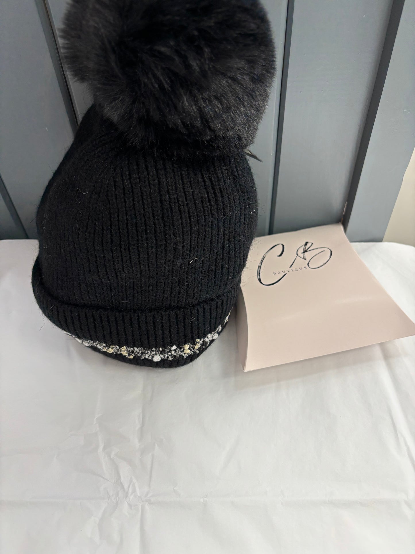 Black with trim woollen bobble hat