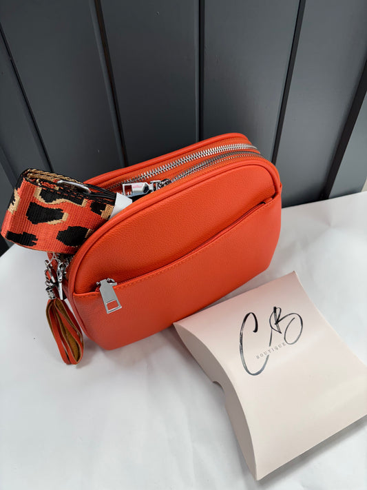 Orange curved hand Bag with tassle